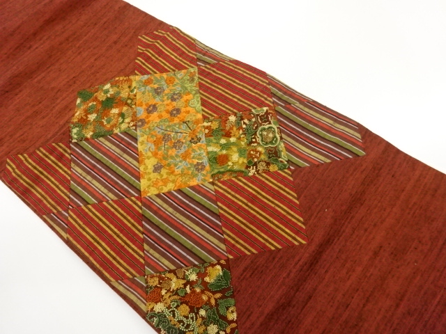 手織り紬切り嵌め相良刺繍縞に草花模様名古屋帯
